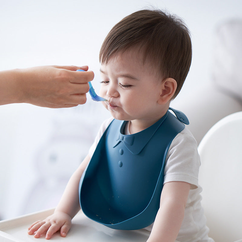 Babero de silicona para bebé con bolsillo para comida