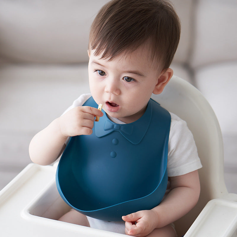 Babero de silicona para bebé con bolsillo para comida