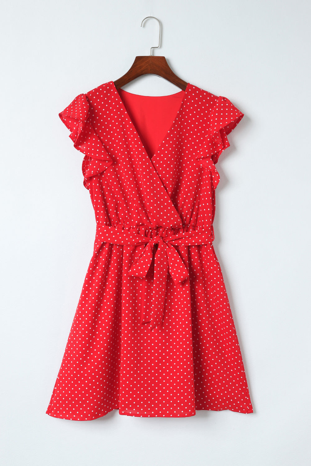 Robe à pois avec col surplis et ceinture nouée